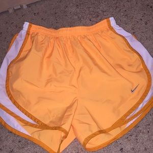 Orange Nike shorts